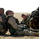 A squad of soldier rests in the dessert waiting orders for an attack during a training a exercise with the U.S. Army 3rd Division. Getty